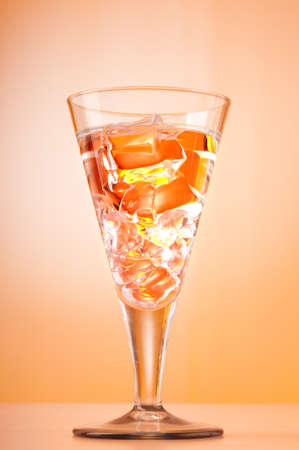 Water in the glass against gradient backgroundの写真素材