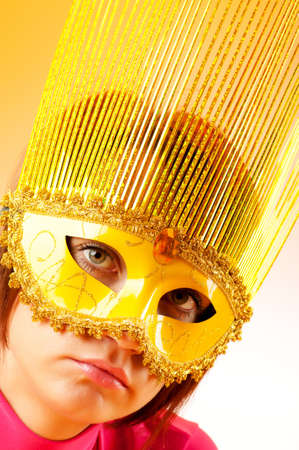 Attractive woman posing in the stylish maskの写真素材