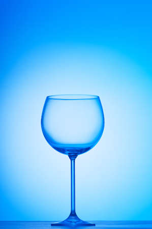 Wine glasses against gradient backgroundの写真素材