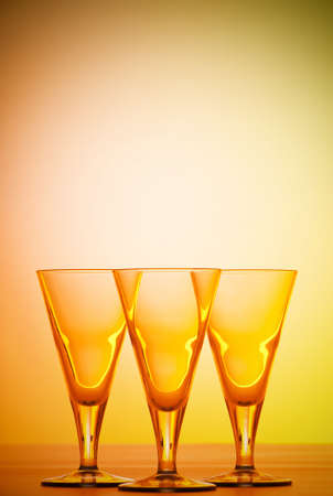 Wine glasses against gradient backgroundの写真素材