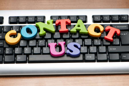Contact us concept with letters on keyboardの写真素材