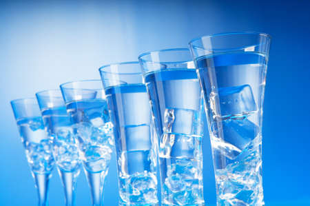 Water in the glass against gradient backgroundの写真素材