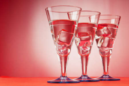 Water in the glass against gradient backgroundの写真素材