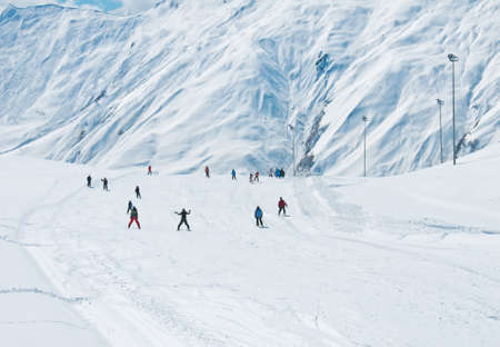 Skiers on the mountain slopeの写真素材