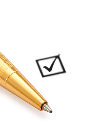 Tick box and pen isolated on whiteの写真素材