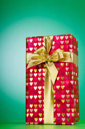 Celebration concept - Gift box against colorful background の写真素材