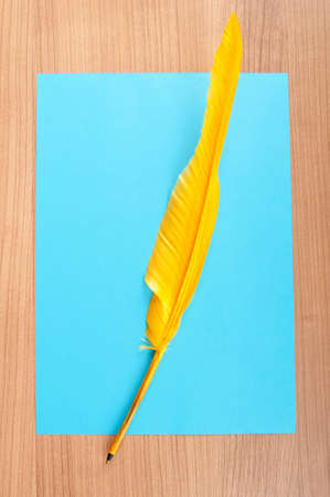 Paper and feather in vintage writing conceptの写真素材