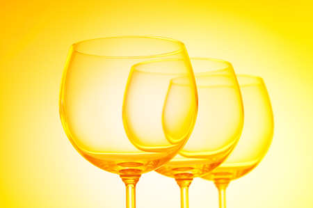 Wine glasses against gradient background