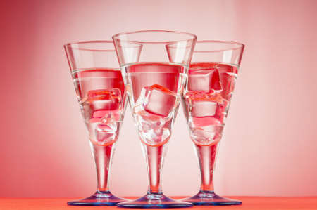 Water in the glass against gradient background