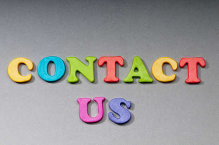Contact us concept with letters on backgroundの写真素材
