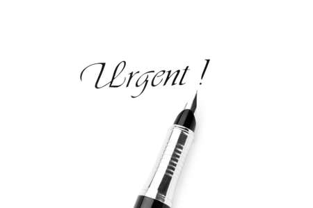 Pen and urgent message isolated on white