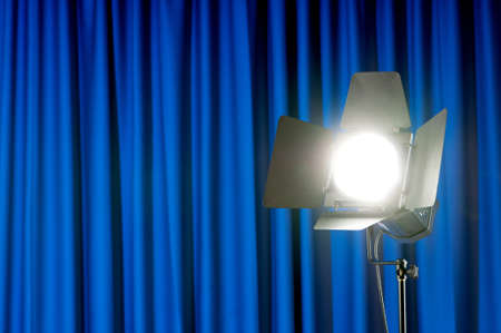 Curtains and projector lights wtih space for your textの写真素材