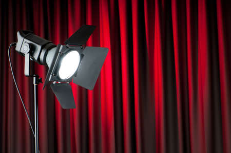 Curtains and projector lights wtih space for your textの写真素材