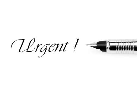 Pen and urgent message isolated on whiteの写真素材