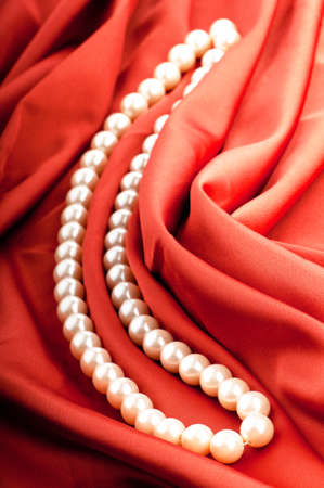 Pearls necklace on satin backgroundの写真素材
