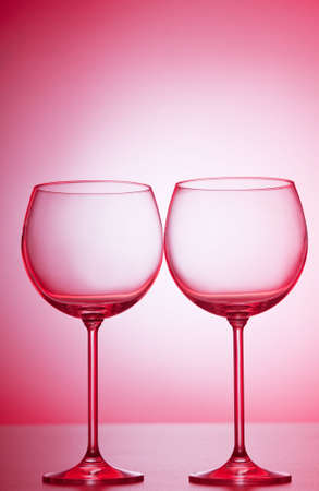 Wine glasses against gradient backgroundの写真素材