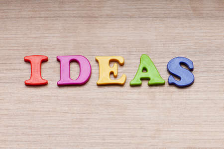 Creativity concept with idea word on backgroundの写真素材