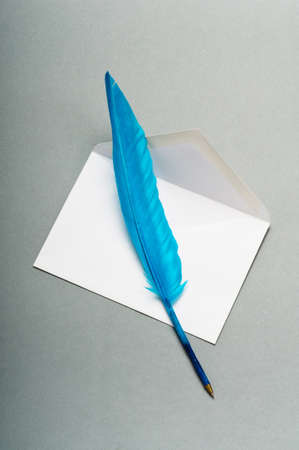 Letter and feather on the backgroundの写真素材