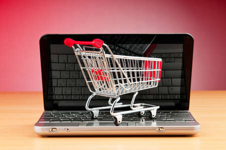 Internet online shopping concept with computer and cart
