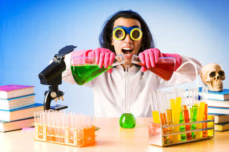 Chemist in the lab experimenting with solutionsの写真素材