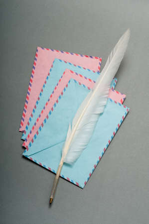 Letter and feather on the backgroundの写真素材