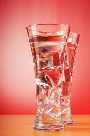 Water in the glass against gradient backgroundの写真素材
