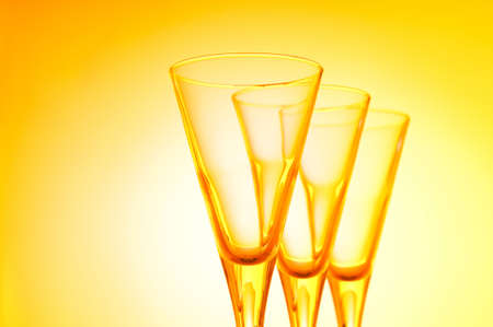 Wine glasses against gradient backgroundの写真素材