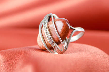 Fashion concept with ring on background