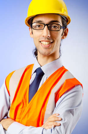 Young construction worker with hard hatの写真素材