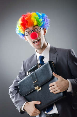Clown businessman in funny business conceptの写真素材