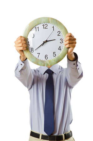 Businessman covering his face with clockの写真素材