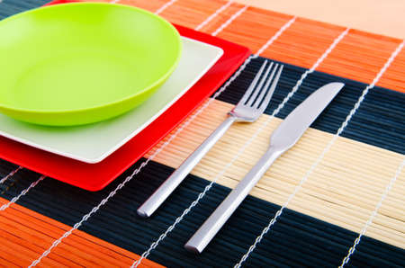 Empty plate with utensils