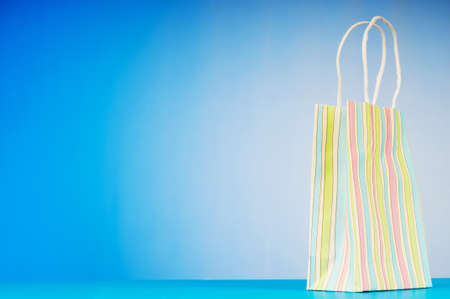 Shopping bags against gradient backgroundの写真素材