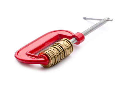 Business concept with clamp and coins isolatedの写真素材