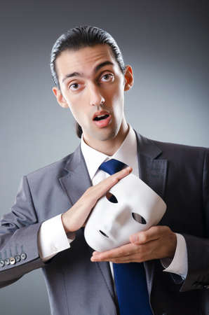 Industrial espionate concept with masked businessmanの写真素材