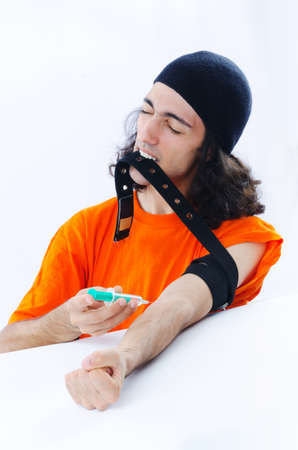 Young druc addict with syringeの写真素材