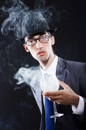 Young man smoking cigaretteの写真素材