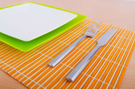 Empty plate with utensils