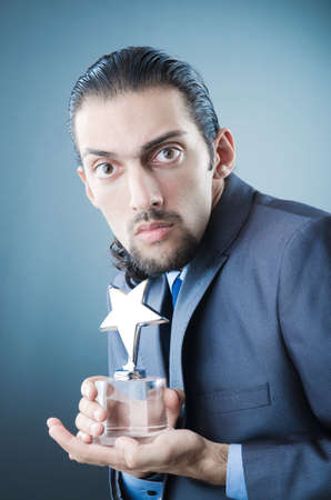 Businessman awarded with star awardの写真素材