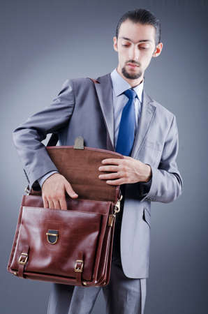 Young businessman with briefcaseの写真素材