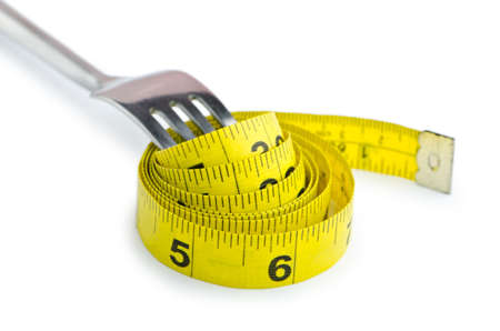 Dieting concept with fork and meter