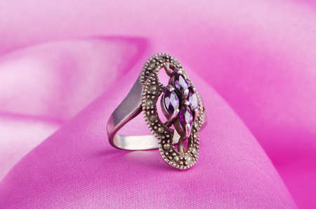 Jewellery ring on the satin backgroundの写真素材