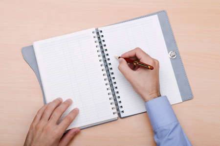 Hand writing a letter