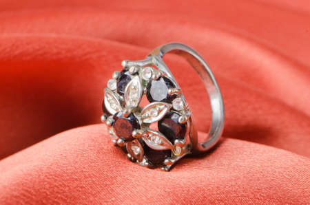 Jewellery ring on the satin backgroundの写真素材