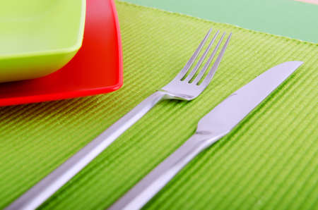 Emtpy plates with utensils on tableの写真素材