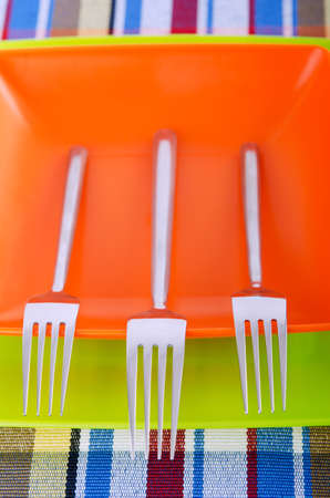 Emtpy plates with utensils on tableの写真素材