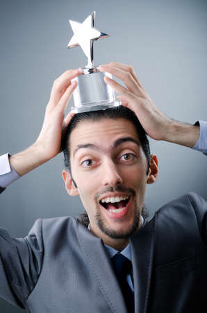 Businessman awarded with star awardの写真素材