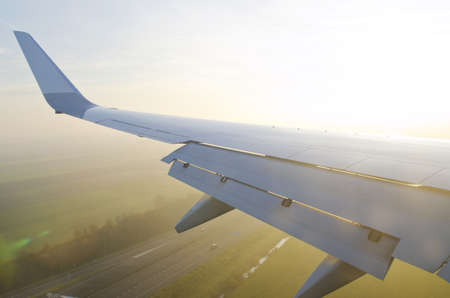 Wing of airplane from windowの写真素材