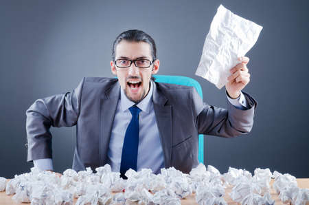 Businessman throwing paper awayの写真素材