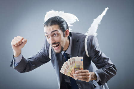Business angel with moneyの写真素材